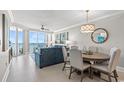 Bright living room area with sliding glass doors out to the deck with views of the ocean at 603 S Ocean Blvd. # 912, North Myrtle Beach, SC 29582