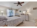 Bright bedroom with ceiling fan, window, and dresser with decorative lamps at 6628 Mallard View Point, Myrtle Beach, SC 29588