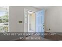A beautiful light blue door opens to the front yard at 68 Voyagers Dr., Pawleys Island, SC 29585