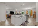 Open-concept living space with a modern kitchen, dining area, and comfortable living room at 847 Flowering Branch Ave., Little River, SC 29566