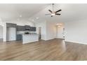 Open concept living room and kitchen featuring modern decor and ample lighting at 1013 Woodside Dr., Conway, SC 29526
