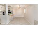 Cozy dining area adjacent to kitchen with breakfast bar seating and light fixture enhancing the space at 10301 North Kings Hwy. # 13-5, Myrtle Beach, SC 29572