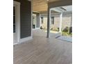 Covered outdoor patio featuring tile flooring and view of backyard space at 1348 Rue De Jean Ave., Myrtle Beach, SC 29579