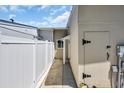 This property has a side yard with a white fence, landscaping rocks, and access to utilities at 1361 Turkey Ridge Rd. # C, Surfside Beach, SC 29575