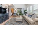 Inviting living room featuring vaulted ceilings, plantation shutters, and access to an outdoor balcony at 1608 Harbor Dr., North Myrtle Beach, SC 29582