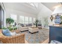 Bright and airy living room with high ceilings, plantation shutters, and stylish furnishings at 1608 Harbor Dr., North Myrtle Beach, SC 29582