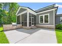 Outdoor living space featuring a built-in grill and screened-in porch at 209 Bouquets Green Way, Myrtle Beach, SC 29579