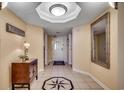Inviting foyer features neutral walls, elegant tile flooring with a compass design, and decorative furnishings at 2151 Bridge View Ct. # 2-803, North Myrtle Beach, SC 29582