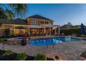 Beautiful pool area with outdoor kitchen, hot tub, and ample patio space perfect for entertaining at 256 Shoreward Dr., Myrtle Beach, SC 29579