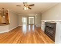 Open living area with hardwood flooring, a fireplace, and lots of natural light, perfect for entertaining at 2600 Henagan Ln., Myrtle Beach, SC 29588