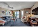 Comfortable living room with a scenic view, complete with plush seating and natural lighting at 3601 S Ocean Blvd. # 8-C, North Myrtle Beach, SC 29582