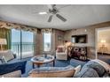 Cozy living room featuring a ocean view balcony, comfortable seating and coastal accents at 3601 S Ocean Blvd. # 8-C, North Myrtle Beach, SC 29582
