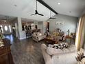 Spacious living room with vaulted ceilings, hardwood floors, comfortable seating, and an open floor plan at 4008 Tupelo Ct., Conway, SC 29526