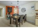 Cozy dining area featuring a modern chandelier, stylish decor, and seating for four at 4276 Santolina Way # A, Murrells Inlet, SC 29576