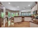 Bright kitchen featuring granite countertops, stainless steel appliances, hardwood floors and bay windows at 4363 Parkland Dr., Myrtle Beach, SC 29579