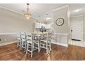 Bright dining area showcasing laminate floors, modern lighting and easy access to the kitchen at 4771 Wild Iris Dr. # 103, Myrtle Beach, SC 29577
