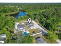 Aerial view showing the home's location, neighborhood, nearby lake, and surrounding greenery at 4862 Mill Pond Rd., Myrtle Beach, SC 29588