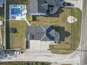 Aerial view of the property, showcasing the layout, backyard, pool, and proximity to surrounding neighborhood at 4862 Mill Pond Rd., Myrtle Beach, SC 29588