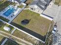 Aerial view of backyard featuring a pool, trampoline, and fence, highlighting outdoor living space and privacy at 4862 Mill Pond Rd., Myrtle Beach, SC 29588