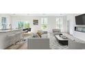 Bright living room with a bar area, comfortable seating, and a view to the outdoors at 492 Sun Colony Blvd., Longs, SC 29568