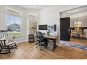 Bright home office with modern desk setup, natural light, and wood floors at 757 Cherry Blossom Dr., Murrells Inlet, SC 29576