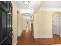 Inviting foyer with beautiful hardwood floors, archways, and a view into the home at 908 Oglethorpe Dr., Conway, SC 29527