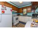 The kitchen has white appliances and light countertops, providing a functional and bright cooking space at 106 Azalea Dr., Conway, SC 29526