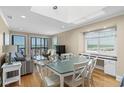 Bright and airy living room featuring ocean views, comfortable seating, and hardwood floors at 108 N Ocean Blvd. # 301, North Myrtle Beach, SC 29582