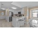 Bright, airy kitchen with white cabinets, granite counters, and stainless steel appliances at 108 N Ocean Blvd. # 308, North Myrtle Beach, SC 29582