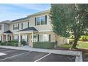 Charming two-story condo with black shutters and a tree-lined yard at 10970 Highway 90 # A5, Little River, SC 29566