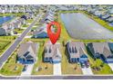 Aerial view of the property shows neighborhood amenities and lake views at 1463 Villena Dr., Myrtle Beach, SC 29579