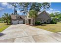 Charming single-story home featuring an attached two-car garage and a long, spacious driveway at 1800 Wood Stork Dr., Conway, SC 29526