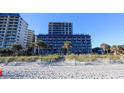 Beachfront resort featuring multiple floors, lawns, sand dunes, and palm trees at 201 77Th Ave. N # 828, Myrtle Beach, SC 29572