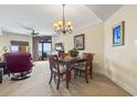 Comfortable dining area and living room with plenty of sunlight, soft carpet and a view of the ocean at 2600 N Ocean Blvd. # 1103, Myrtle Beach, SC 29577