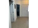 Inviting foyer with tile flooring, white doors, and view into an office space at 307 Black Oak Ln. # 102, Murrells Inlet, SC 29576