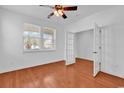 Bedroom with hardwood floors, natural light, ceiling fan, and french doors at 3315 Saddlewood Circle, Myrtle Beach, SC 29579