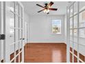 Bright office space with hardwood floors, ceiling fan, and natural light from the window at 3315 Saddlewood Circle, Myrtle Beach, SC 29579