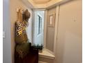 Cozy entryway featuring a small bench with storage, hooks for coats, and natural light at 415 Ocean Creek Dr. # 2149, Myrtle Beach, SC 29572