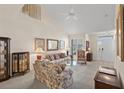 Inviting living room with vaulted ceiling, carpet, and a view of the front door and staircase at 432 Warrington Way # 432, Murrells Inlet, SC 29576