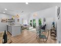 Open-concept living room and kitchen area with modern decor and plenty of natural light at 4470 Little River Inn Ln. # 1005, Little River, SC 29566