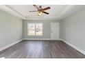 Bright living room with gray floors, tray ceilings and natural light from a large window at 469 Overcrest St., Myrtle Beach, SC 29579