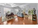Spacious living room showcasing vaulted ceilings, hardwood floors, and ample natural light at 4814 Greenhaven Dr., North Myrtle Beach, SC 29582