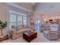 Cozy living room with a comfortable sofa, large window, and an open concept layout leading to the kitchen at 503 20Th Ave. N # 15-A, North Myrtle Beach, SC 29582