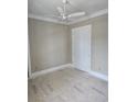 Cozy bedroom with neutral paint, ceiling fan and a spacious closet at 507 Hillside Dr. N, North Myrtle Beach, SC 29582