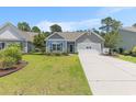 Beautiful single-Gathering home with a manicured lawn and long driveway, a perfect suburban retreat at 5581 Plantersville Pl., Myrtle Beach, SC 29579