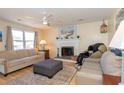 Comfortable living room with a fireplace, ceiling fan, and neutral-toned sofas at 602 Six Lakes Dr., Myrtle Beach, SC 29588
