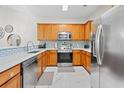 Bright kitchen with stainless steel appliances and wood cabinets at 6253 Catalina Dr. # 1533, North Myrtle Beach, SC 29582