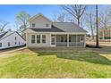 Spacious backyard with a screened porch, ideal for relaxation and outdoor living at 1061 Edenton Dr., Calabash, NC 28467