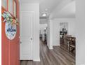 Welcoming entryway flows into the home with gorgeous floors and views to the kitchen and living spaces at 1123 Fairway Ln. # 1123, Conway, SC 29526