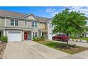 Charming townhomes boast attached garages, nicely landscaped yards, and covered front entryways at 1123 Fairway Ln. # 1123, Conway, SC 29526